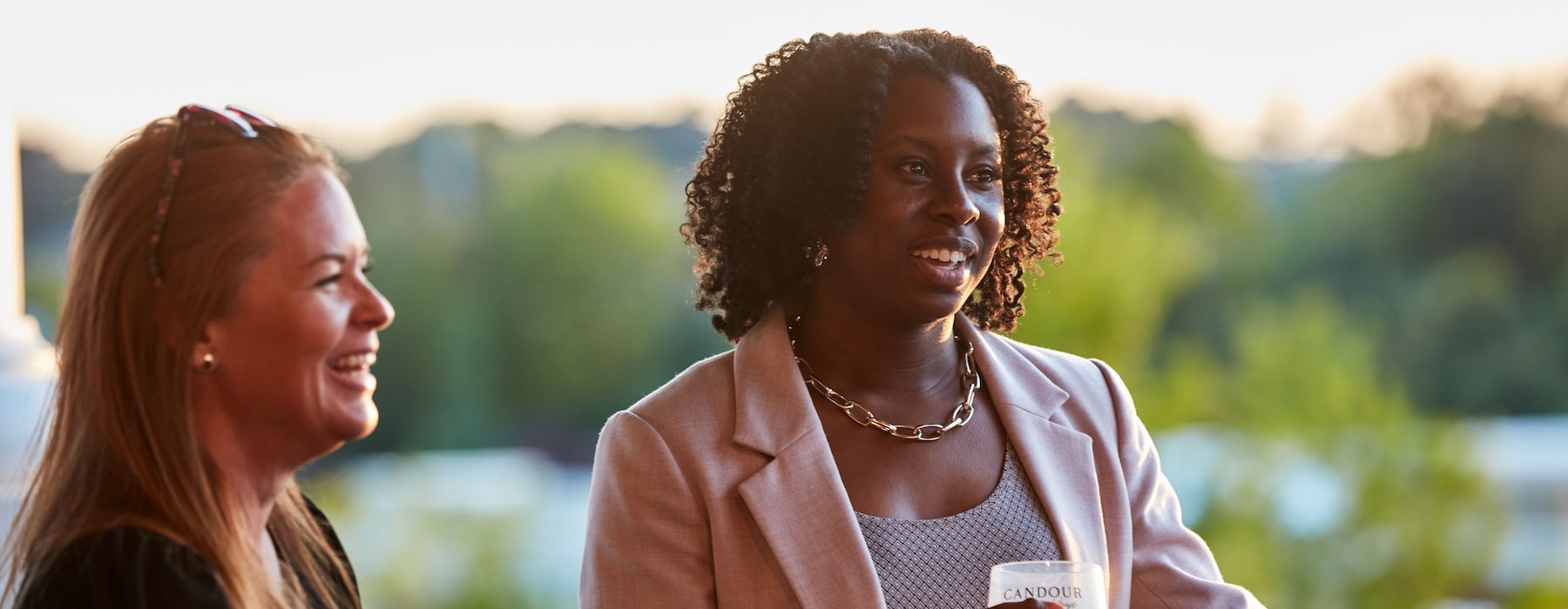 a woman holding a cup